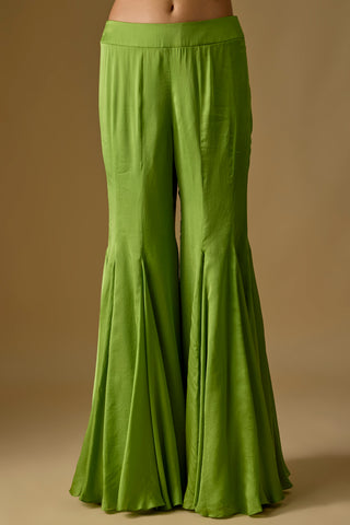 Detail of the olive green flared satin sharara cut in godet panels by Asaga at Mrs. G