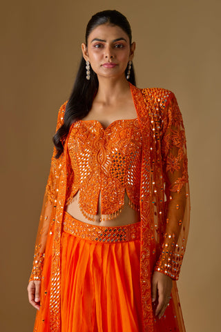 Waist-up close-up of the orange scalloped corset blouse with mirror work under the open net jacket by Asaga at Mrs. G