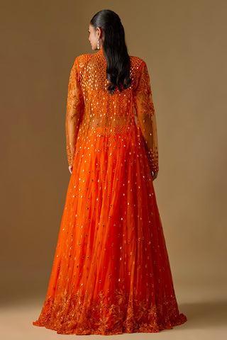 Back view of the orange sheer long jacket with scattered mirrors and a heavy embroidered hem by Asaga at Mrs. G