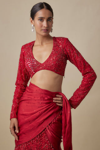 Waist-up view of the red full-sleeve blouse with mirror work and a satin wrap at the hip by Asaga at Mrs. G