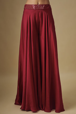 Close-up of the red satin sharara and its beaded mirror waistband by Asaga at Mrs. G