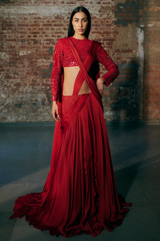 Front view of the red pre-draped satin organza saree with a diagonal pallu and a mirror work blouse by Asaga at Mrs. G