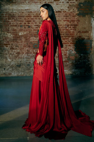 Side view of the red full-sleeve sequin blouse and the long pallu trailing behind the saree by Asaga at Mrs. G
