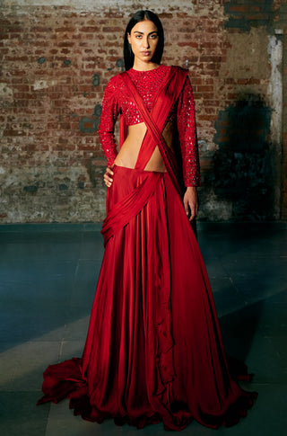 Full-length front view of the red pre-draped saree skirt flaring to a train by Asaga at Mrs. G