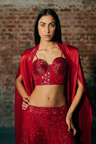 Waist-up view of the red sweetheart corset with mirror pieces under the open satin cape by Asaga at Mrs. G