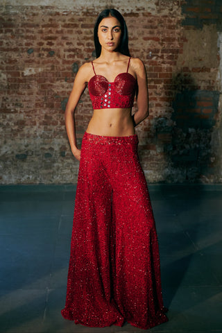Front view of the red corset and wide-leg sharara without the cape, hands behind the back by Asaga at Mrs. G