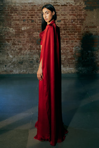 Side profile of the red long satin organza cape falling to the floor by Asaga at Mrs. G