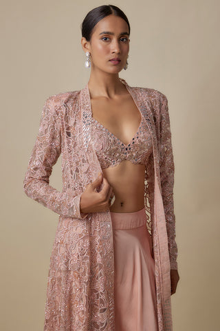 Waist-up view of the rose gold jacket with mirror panels worn open over a mirror-work bralette by Asaga at Mrs. G
