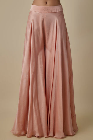 Close-up of the wide flowy rose gold satin sharara and fitted waistband by Asaga at Mrs. G