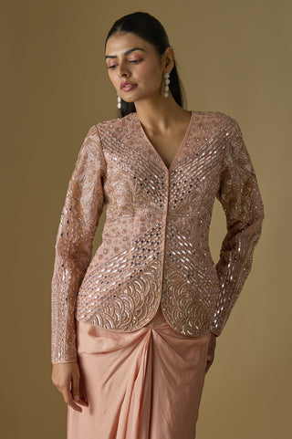 Waist-up view of the rose gold V-neck jacket with mirrors, pearls and scalloped embroidery by Asaga at Mrs. G