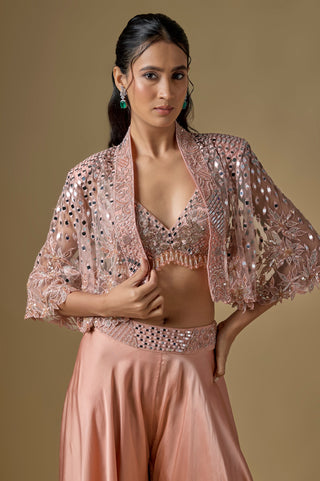 Waist-up close-up of the rose gold mirror work bralette and the open cape with tonal floral embroidery by Asaga at Mrs. G