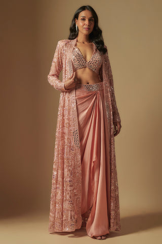 Front view of rose gold dyon long paisley jacket, mirror bralette and side-drape satin skirt by Asaga at Mrs. G