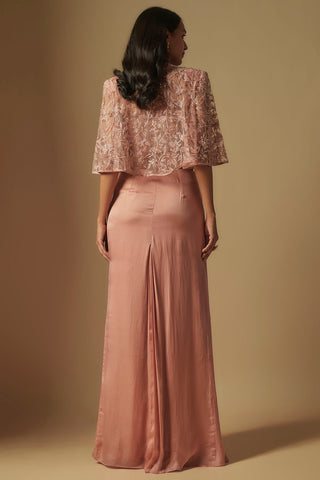 Back view of the rose gold net cape with padded shoulders over a plain satin skirt by Asaga at Mrs. G