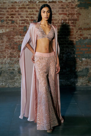 Front view of a rose gold mirror-work sharara set with a long satin organza cape worn open by Asaga at Mrs. G