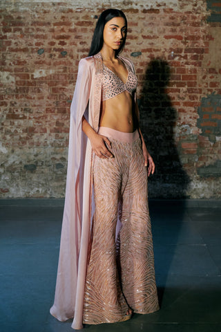 Three-quarter view of the rose gold set with the long cape falling behind one arm by Asaga at Mrs. G