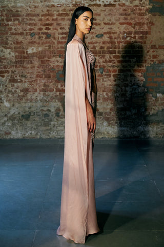 Side view of the rose gold long satin cape falling to the floor beside the sharara by Asaga at Mrs. G