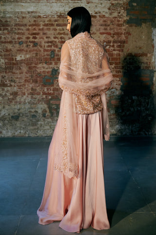 Back view of the rose gold jacket top with the net dupatta falling over the shoulders by Asaga at Mrs. G