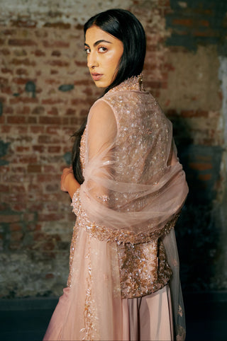 Back three-quarter view of the rose gold jacket with the scalloped dupatta border by Asaga at Mrs. G