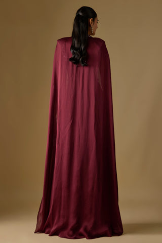 Back view of the wine floor-length satin cape falling from the shoulders by Asaga at Mrs. G