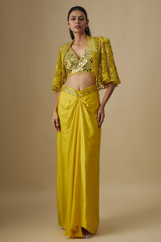 Full-length front view of a yellow draped satin skirt with a full mirror blouse and a net cape by Asaga at Mrs. G