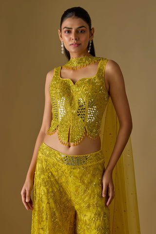 Waist-up close-up of the yellow sweetheart corset, beaded collar and net dupatta from one shoulder by Asaga at Mrs. G