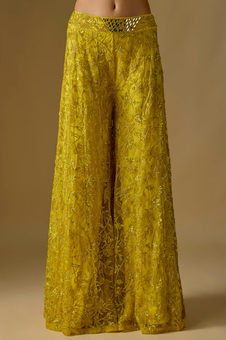 Detail of the yellow wide-leg sharara with sequin vine embroidery and a mirror work waistband by Asaga at Mrs. G