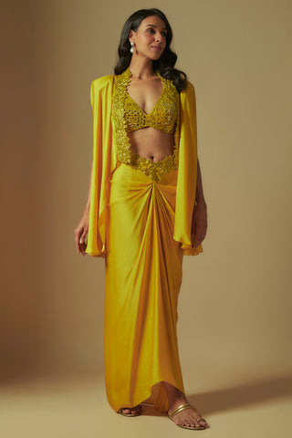 Front view of yellow flux mirror work blouse, knotted satin drape skirt and short cape by Asaga at Mrs. G