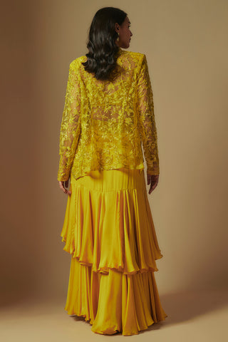 Back view of yellow sheer embroidered jacket over tiered satin drape skirt by Asaga at Mrs. G