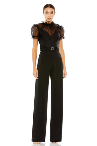 Full-length front view of the black jumpsuit with a sheer yoke, puff sleeves and belted waist by Mac Duggal at Mrs. G