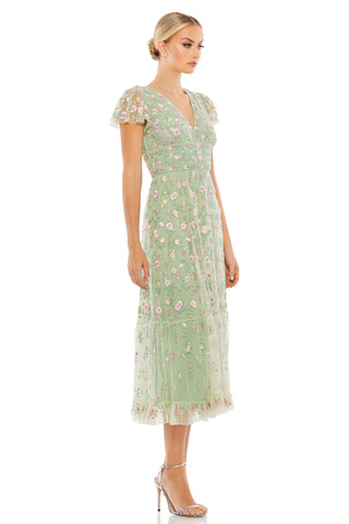 Side view of the sage embroidered midi dress showing the tiered skirt and ruffle hem by Mac Duggal at Mrs. G