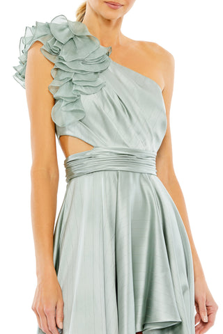 Close-up of the tiered shoulder ruffle, side cutout and ruched waistband on the sage gown by Mac Duggal at Mrs. G
