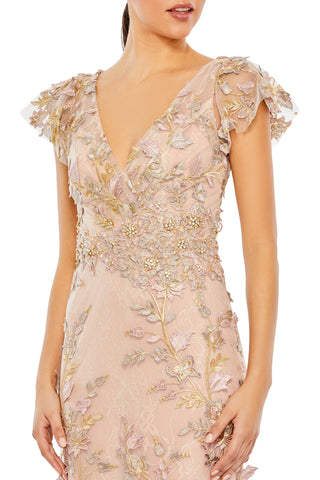 Zoomed-in close-up of the wrap-over bodice, beaded floral waist and flutter sleeves by Mac Duggal at Mrs. G
