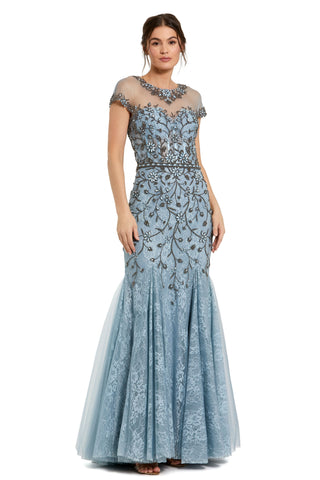 Full-length three-quarter view of the slate blue mermaid gown with illusion neckline and short sleeves by Mac Duggal at Mrs. G
