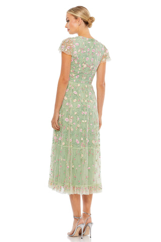 Back view of the sage midi dress showing the all-over floral embroidery and sheer cap sleeves by Mac Duggal at Mrs. G