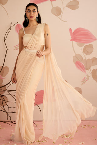 Front view of the ivory draped saree with the long georgette pallu in motion at Mrs. G