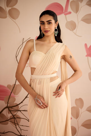 Waist-up view of the ivory saree showing the sweetheart strappy blouse and belted waist at Mrs. G
