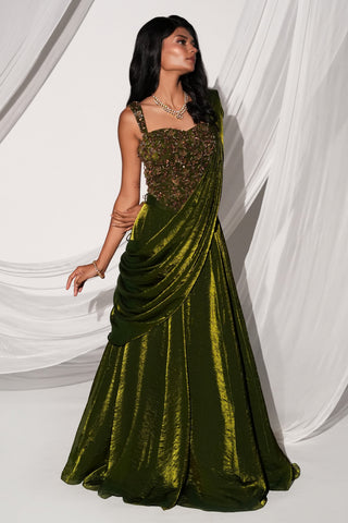 Three-quarter side view of the drape crossing the body over the full olive green skirt by Kiyohra at Mrs. G