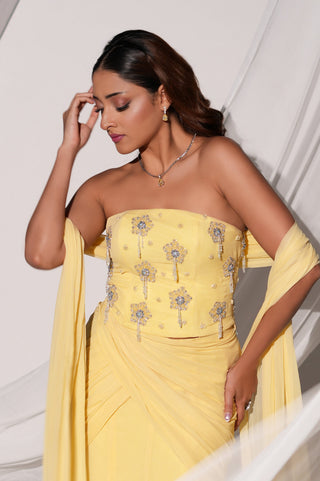 Waist-up view of the strapless blouse with floral beadwork and hanging bead tassels by Kiyohra at Mrs. G