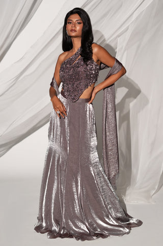 Full-length front view of the gray metallic lehenga set with one-shoulder blouse and fishtail skirt by Kiyohra at Mrs. G