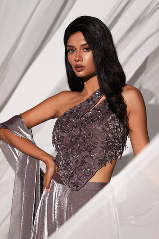 Close-up of the one-shoulder blouse with cut-out strap and hand embroidered beadwork by Kiyohra at Mrs. G