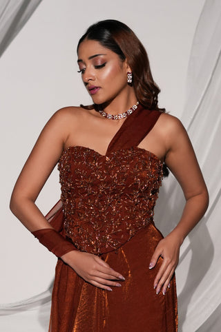 Three-quarter front view of the copper brown saree set with the sheer drape falling along the skirt by Kiyohra at Mrs. G