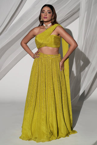 Full-length front view of the green lehenga set with pleated one-shoulder blouse and sequin skirt by Kiyohra at Mrs. G