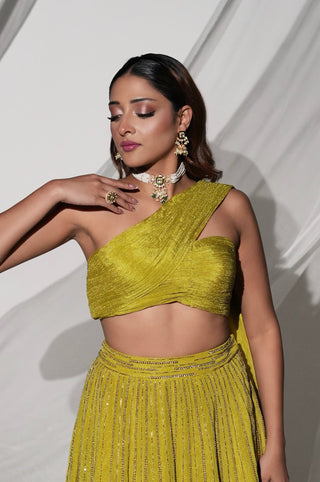 Three-quarter front view of the green lehenga set showing the pleated blouse and waistband by Kiyohra at Mrs. G