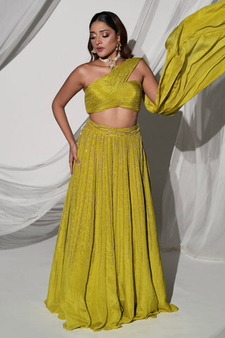 Front view of the green lehenga set with the attached drape lifted away from the shoulder by Kiyohra at Mrs. G