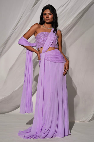 Front view of the purple pre-draped saree set with the drape over one shoulder and a trailing hem by Kiyohra at Mrs. G