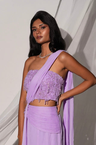 Three-quarter view of the purple saree set with the beaded corset top and flared georgette skirt by Kiyohra at Mrs. G