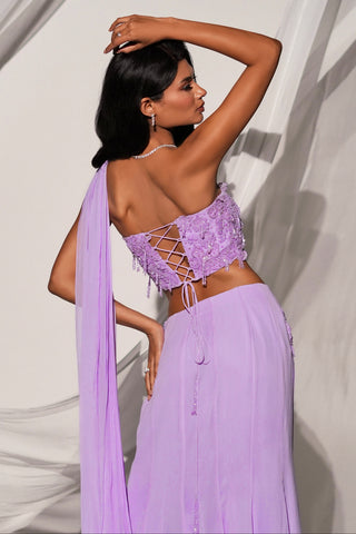 Back view of the purple corset top with criss-cross lace-up back and bead fringe over the skirt by Kiyohra at Mrs. G