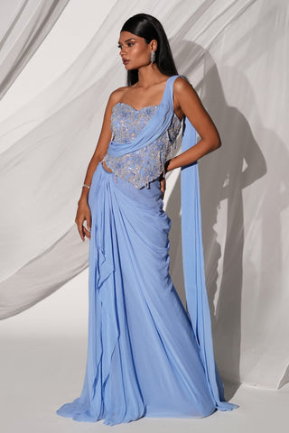Three-quarter view of the blue saree set with the attached drape falling down the side to the hem by Kiyohra at Mrs. G