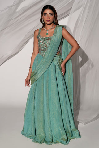 Full-length front view of the green pre-draped saree-lehenga with a beaded blouse and drape by Kiyohra at Mrs. G