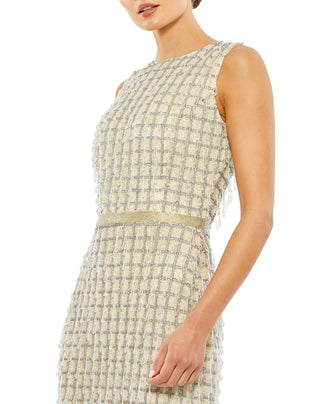 Zoomed-in close-up of the sequin check pattern, pearlescent beads, bead fringe and beaded waistband in beige by Mac Duggal at Mrs. G